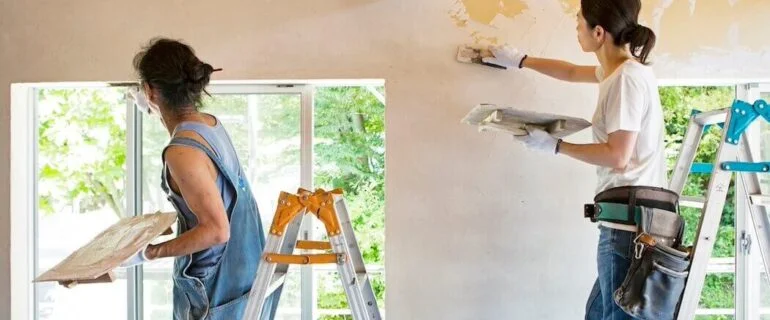 Two women making home improvements