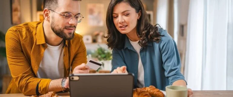 Couple checking their credit score before applying for a loan