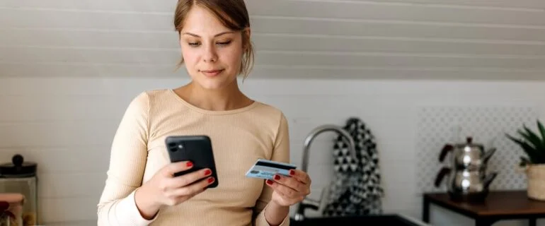 Woman checking her credit score on her phone