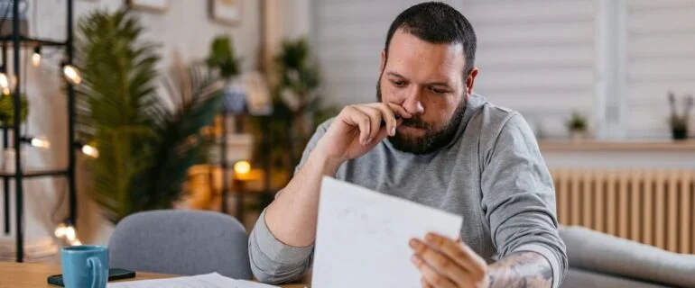 Man looking at debt consolidation options